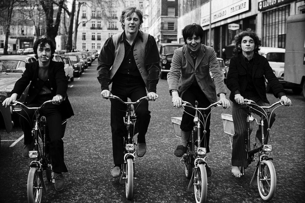 The Easybeats ride bicycles around Berkeley Square, London, circa 1968. (Photo by Andrew Maclear/Hulton Archive/Getty Images)