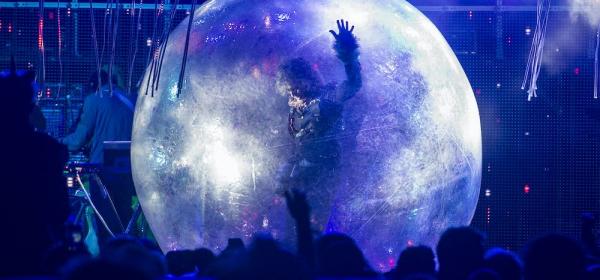 Watch Flaming Lips Perform A Socially Distant “Race for the Prize” In Giant Bubbles on Colbert